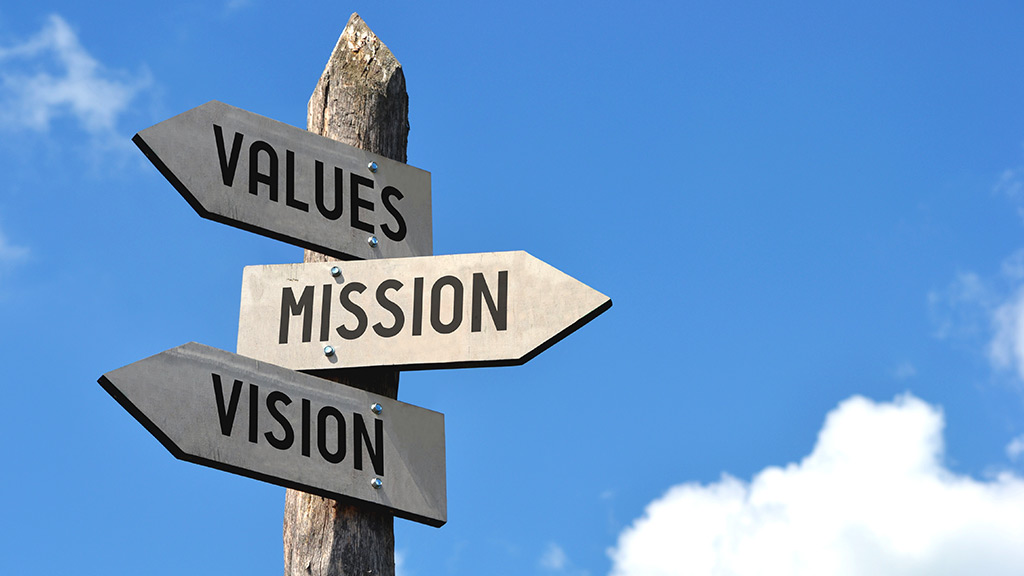 three signs pointing in different directions that read values, mission, mission respectively
