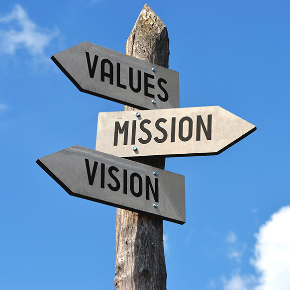 three signs pointing in different directions that read values, mission, mission respectively